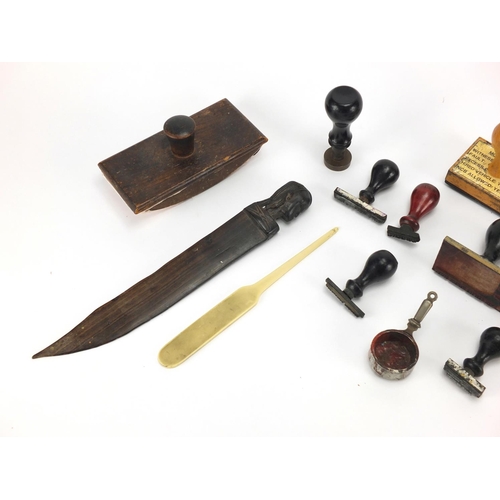 378 - Bag of objects including an antique leather tape measure, ink stamps and a ebonised letter opener