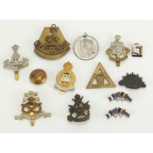 684 - Military interest cap badges and brooches, including two sterling silver and enamel