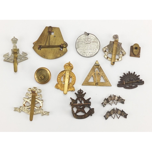 684 - Military interest cap badges and brooches, including two sterling silver and enamel