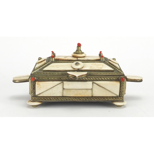 334 - Middle Eastern camel bone jewel box, the hinged lid with coral mounts, 15cm wide