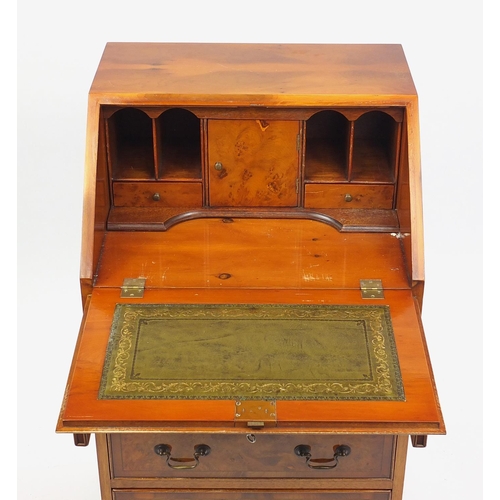 2 - Yew bureau fitted with a fall and fitted interior above four graduated drawers, 95cm H x 51cm W x 44... 