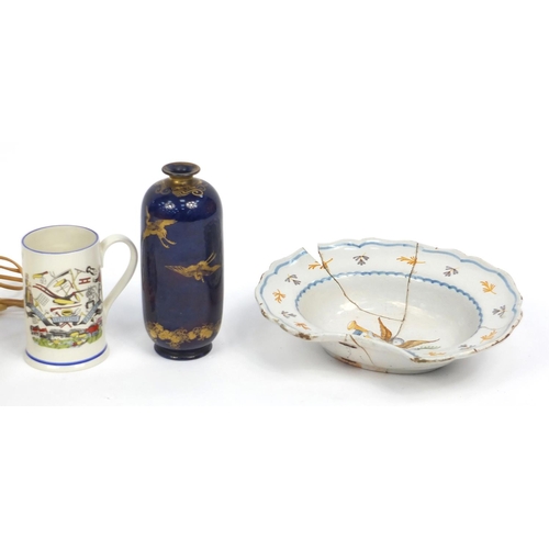 411 - Assorted china including an antique tin glazed barbers bowl, Imari pattern plates and a conch shell ... 