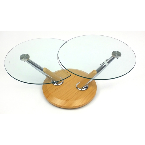 2013 - Stylish chrome and light wood, glass topped coffee table with revolving top, 44.5cm high