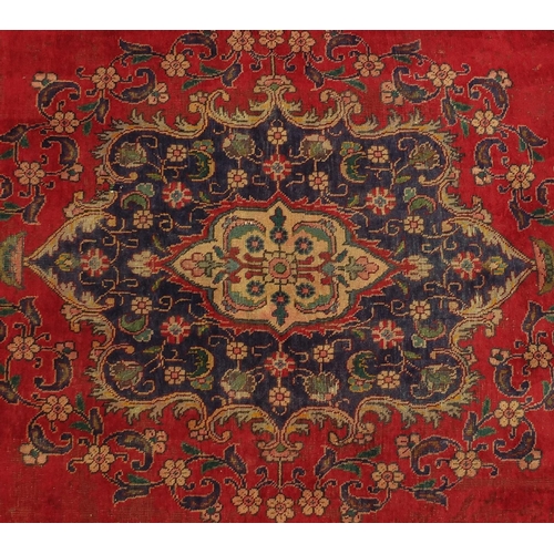 2024 - Rectangular Persian Hamadan rug, having an all over floral design onto a red ground, 320cm x 215cm