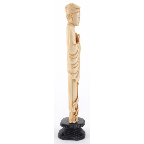 2301 - Chinese carved ivory okimono of a gentleman holding a scroll, on hardwood stand, 22cm high
