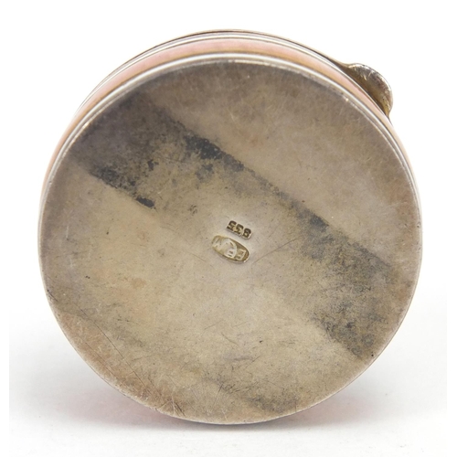 2303 - Circular continental 835 silver and pink guilloche enamel pill box, with hinged lid and gilt interio... 