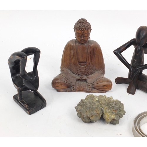 570 - Miscellaneous items including a carved wooden Buddha and three Modernist figures