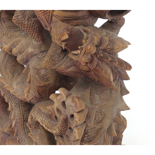 2038 - Floor standing wooden carving of a Chinese dragon, 71cm high