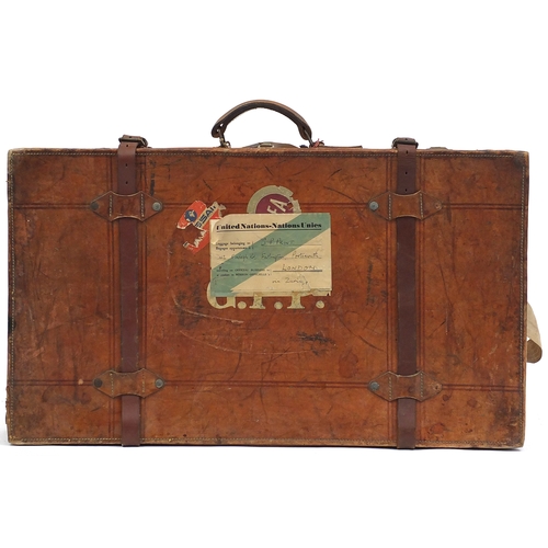 2033 - Vintage tan leather suitcase with BEA labels and carrying handles, 81cm wide