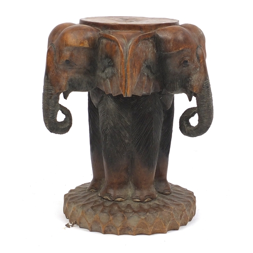 62 - Carved wooden elephant stool, 52cm high