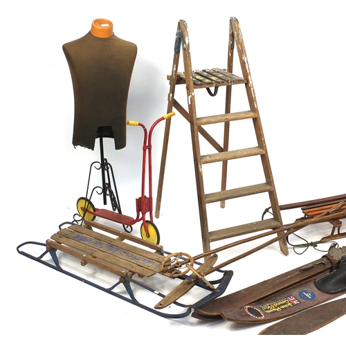 91 - Vintage items including a Tri-ang scooter, mannequin, wooden ski's, sledge and a wooden step ladder