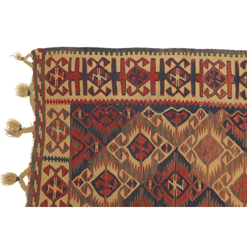 2010 - Rectangular Turkish Kilim rug having an all over geometric design, predominantly in blues and reds, ... 