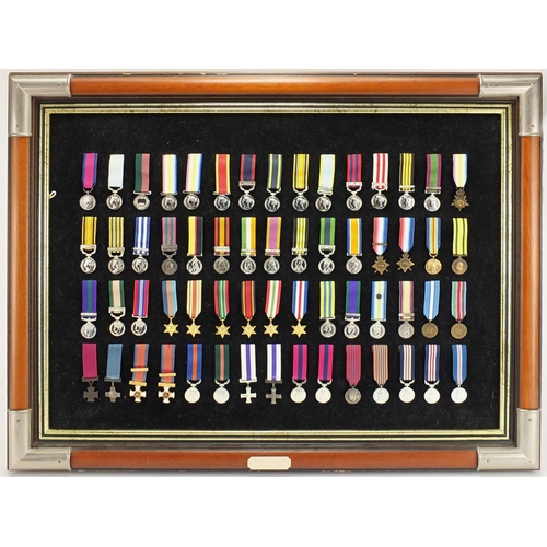 2069 - British Gallantry and Campaign medals by The Danbury Mint, serial number 1193, overall 65cm x 50cm