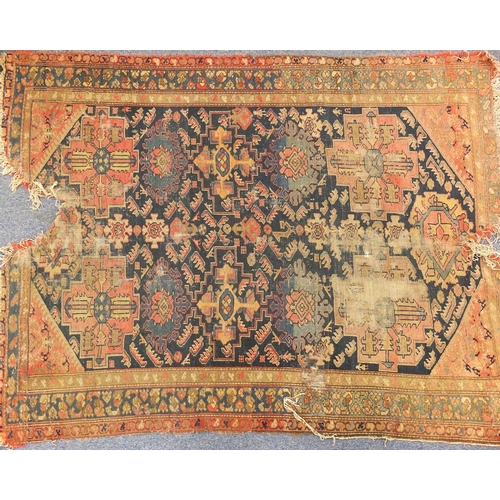 14 - Two Persian rugs, the larger approximately 180cm x 115cm