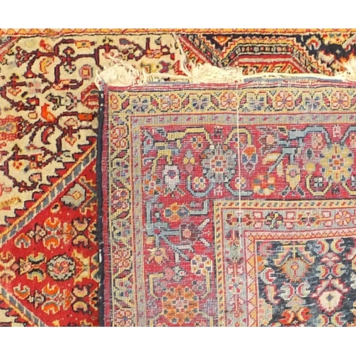14 - Two Persian rugs, the larger approximately 180cm x 115cm