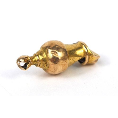 248 - Unmarked gold whistle charm, 2.8cm long, approximate weight 1.1g