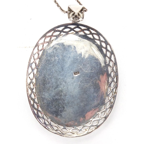 284 - Large silver cameo style pendant on chain, the pendant 7cm in length, approximate weight 33.5g