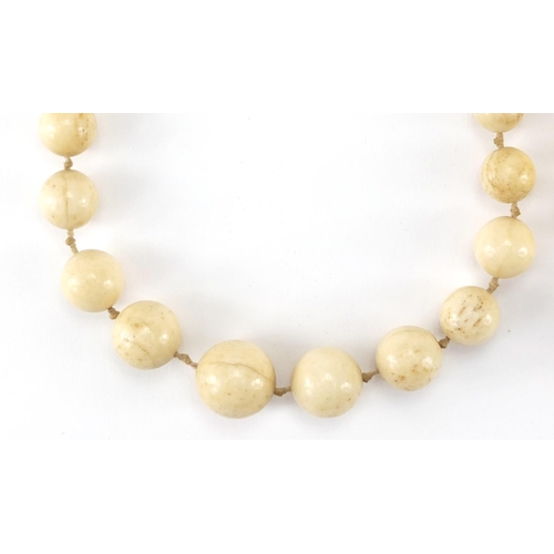 289 - Two antique Chinese ivory necklaces, the largest bead 1.8cm in diameter, approximate weight 160.0g