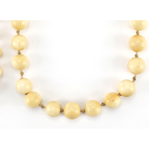 289 - Two antique Chinese ivory necklaces, the largest bead 1.8cm in diameter, approximate weight 160.0g