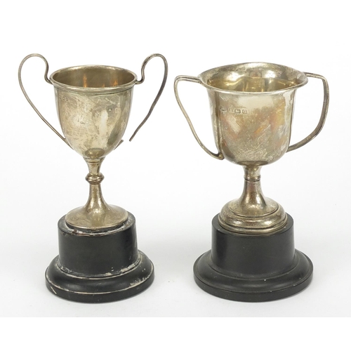 327 - Two silver trophy cups with hard wood stands, Birmingham and London hallmarks, approximately 7.5cm h... 