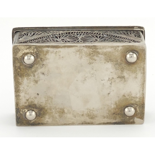 329 - Unmarked filigree silver coloured metal box with hinged lid, 11.5cm in length