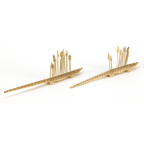 349 - Two sets of carved bone crocodile tooth picks