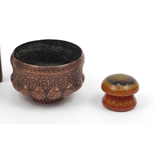 586 - Middle Eastern items including a lacquered jar and cover, copper bowl profusely embossed with vines ... 