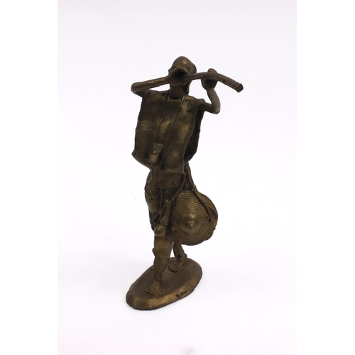 588 - Middle Eastern bronze figure playing a musical instrument, 30cm high