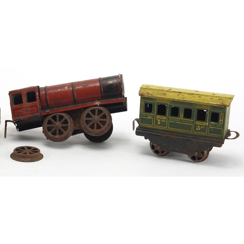 591 - Vintage tin plate locomotive and carriages