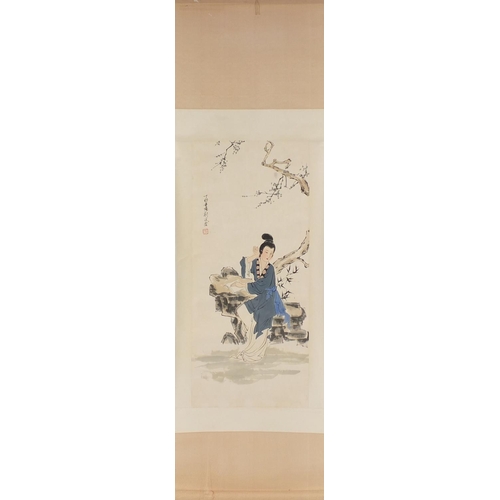 592 - Chinese scroll decorated with a central view of a female reading a text, signed with seal and charac... 