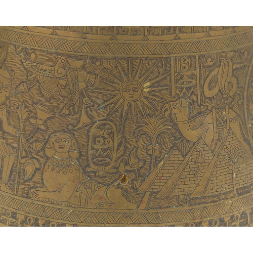 597 - Egyptian brass pot together with a large tray,  both profusely engraved with figures, the tray 70cm ... 