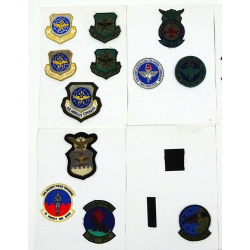 645 - Eight Military interest cards of USAF fighter pilot squadron patches including F16 and shield exampl... 