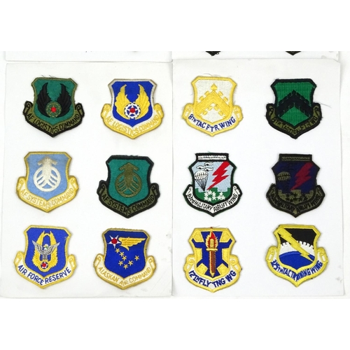 646 - Four cards of US air force regiment patches including special forces and air lift examples