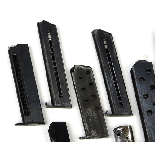 656 - Ten Military interest pistol magazines including Browning examples