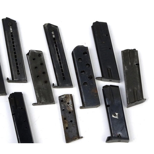 656 - Ten Military interest pistol magazines including Browning examples