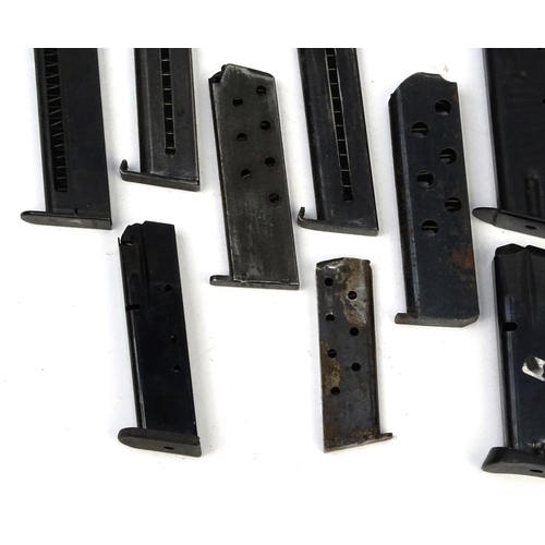 656 - Ten Military interest pistol magazines including Browning examples