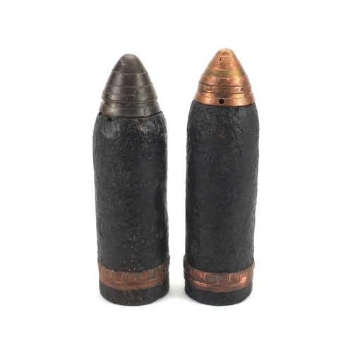 665 - Pair of British Military interest powder shells with heads