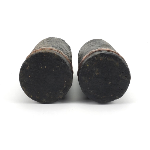 665 - Pair of British Military interest powder shells with heads