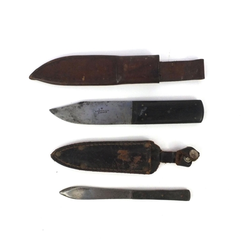 705 - W.Thornhill & Co stainless steel bladed knife with ebony handle and leather sheaf and one other, the... 