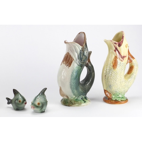 128 - Four fish spill vases together with a pair of Hummel fish salt and peppers, the vases including a Da... 