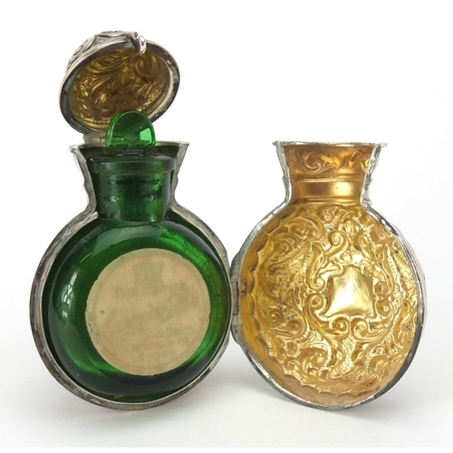 41 - Miniature silver cased green glass scent bottle embossed with birds and foliage, Birmingham 1901, 8.... 