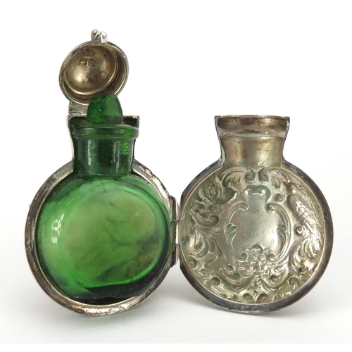 40 - Miniature silver cased green glass scent bottle by William Comyns, the case embossed with birds and ... 