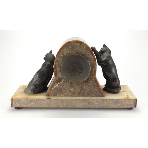 601 - Art Deco marble and onyx  mantel clock, mounted with two bronzed cats, the silvered dial with Arabic... 