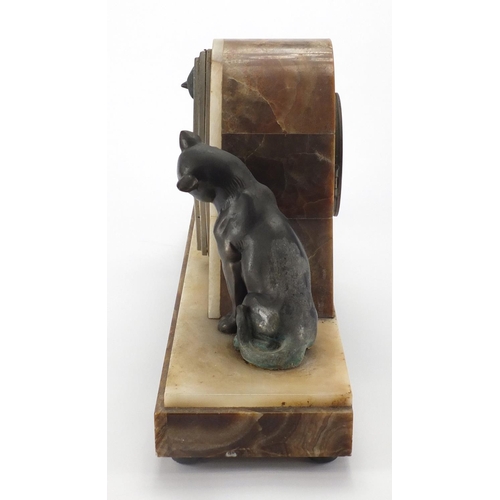 601 - Art Deco marble and onyx  mantel clock, mounted with two bronzed cats, the silvered dial with Arabic... 