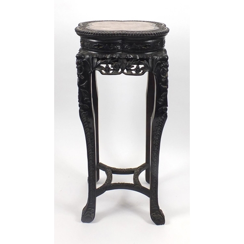 392 - Chinese hardwood plant stand with inset marble top, carved with flower heads and berries, 92.5cm hig... 