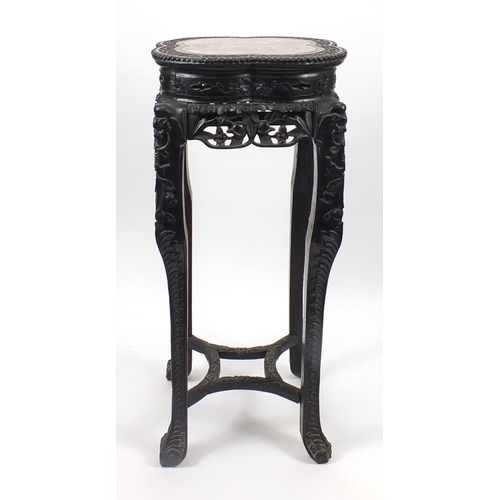 392 - Chinese hardwood plant stand with inset marble top, carved with flower heads and berries, 92.5cm hig... 