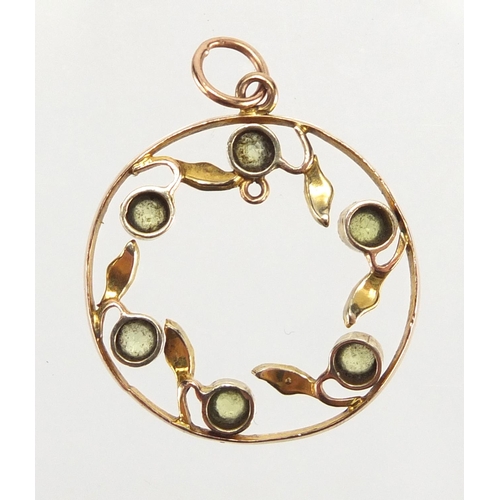 764 - 9ct gold Peridot and seed pearl pendant, 2.2cm in diameter, approximate weight 1.7g