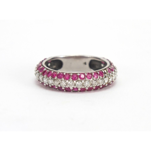 695 - Unmarked white metal Diamond and Ruby half eternity ring, size P, approximate weight 4.5g