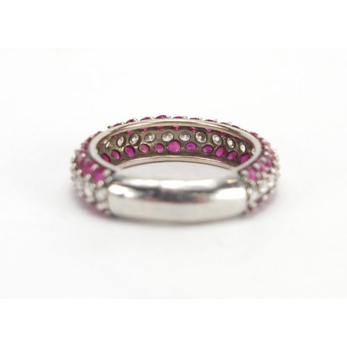 695 - Unmarked white metal Diamond and Ruby half eternity ring, size P, approximate weight 4.5g