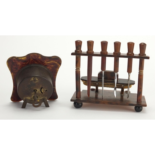 65 - Collection of faux tortoiseshell including hand brushes, pair of candlesticks and a strut clock, the... 